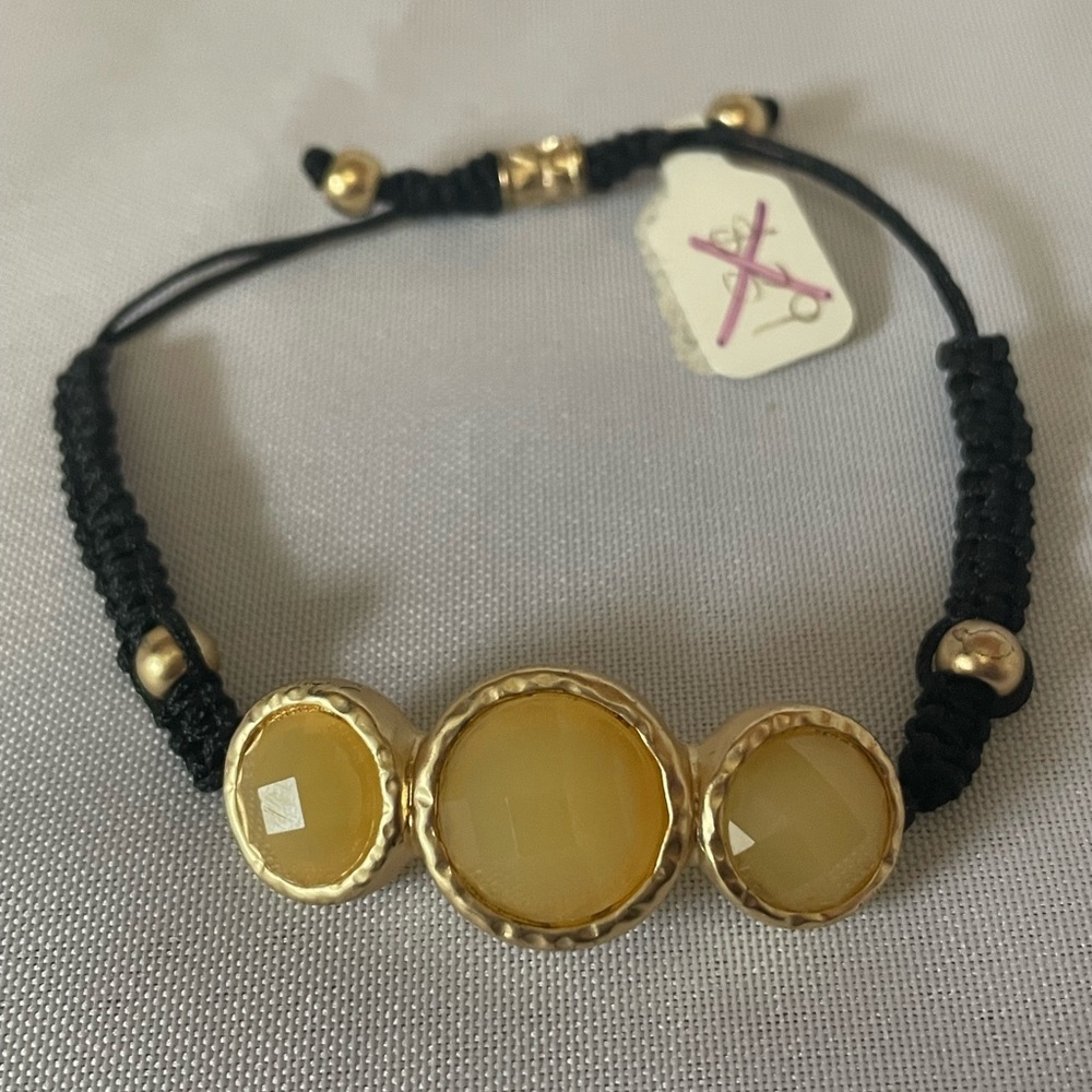 Amber colored stone and black bracelet